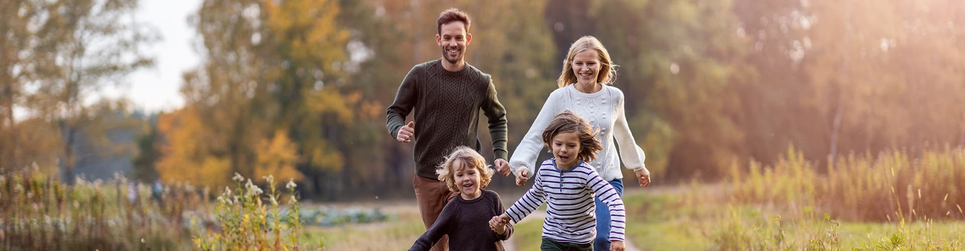 Family running through field