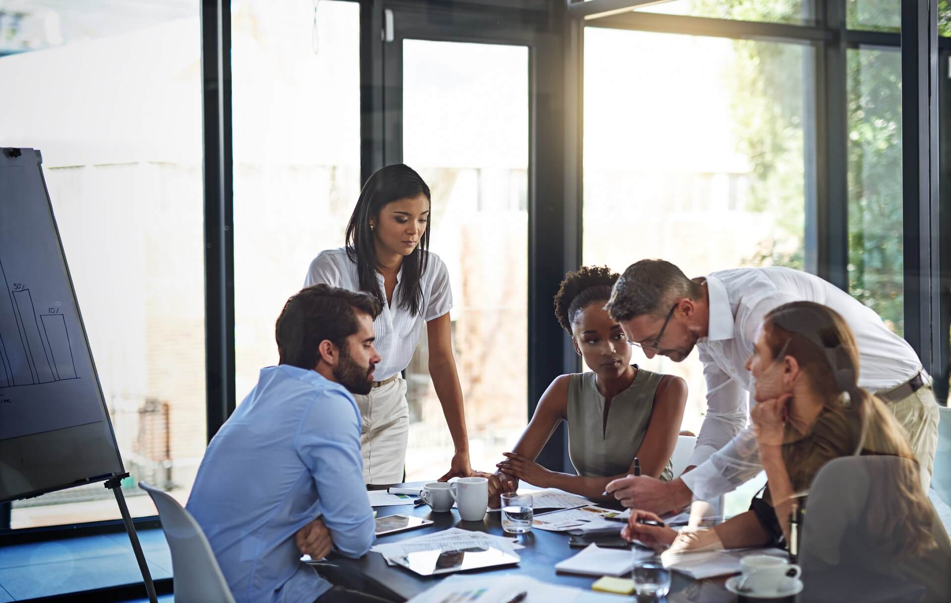 LDI Investment Solutions Webinars_Three women and two men sitting at a table discussing work related matters