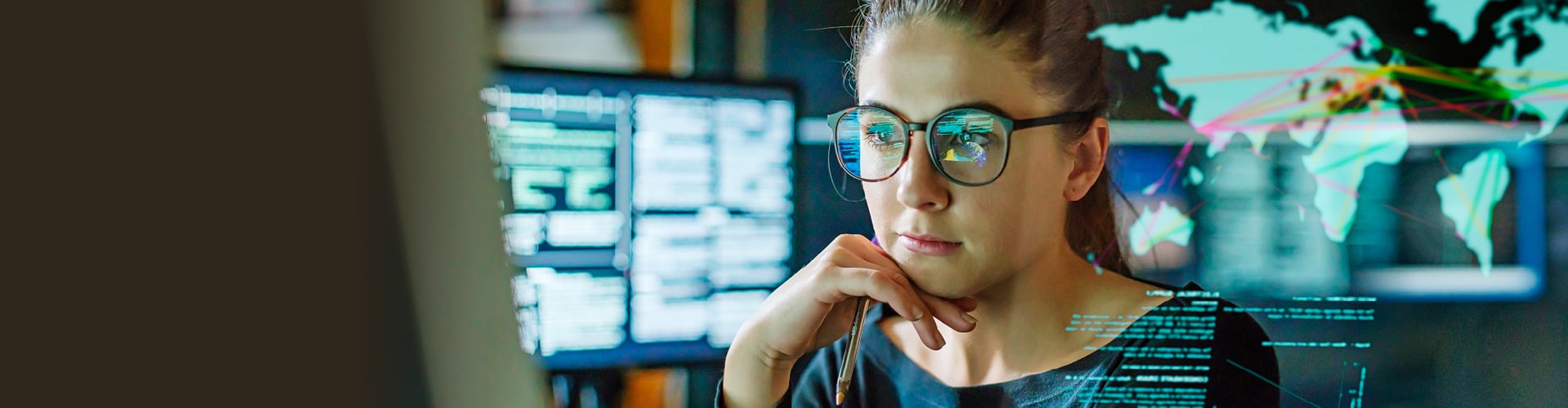 Woman looking at computer screen in thought