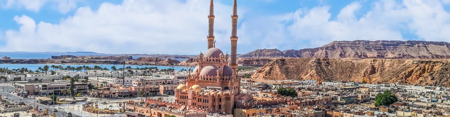 panoramic view of a mosque by the sea