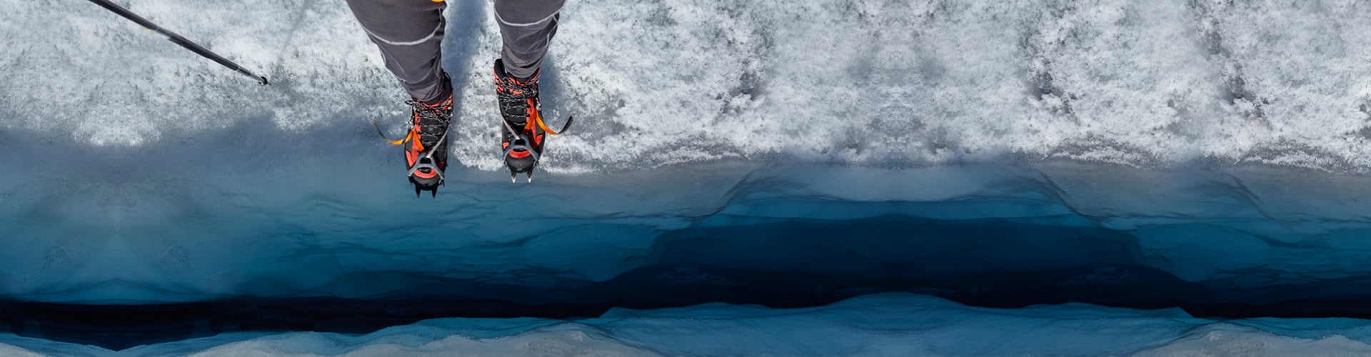 Boots on snowy cliff edge