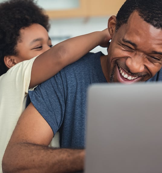 Smiling man with his son