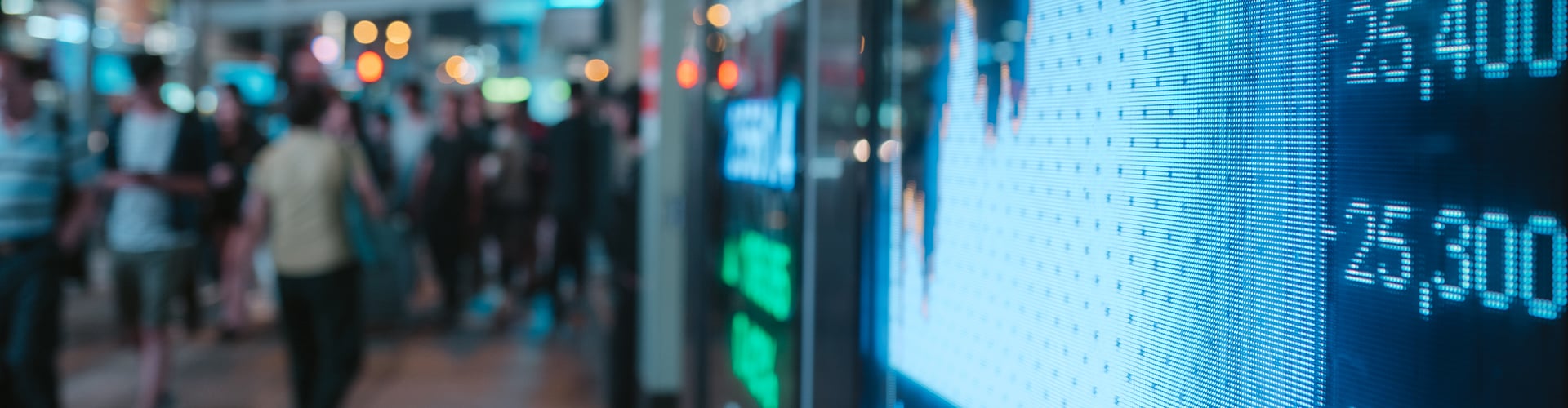 Large outdoor screen displaying share prices