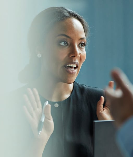 Woman talking in work meeting