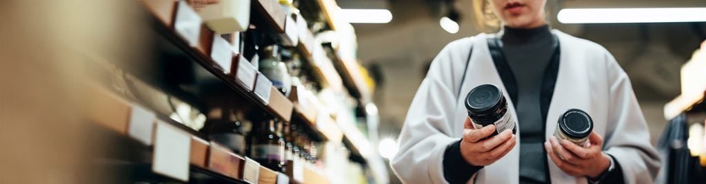 lady holding products in the supermarket