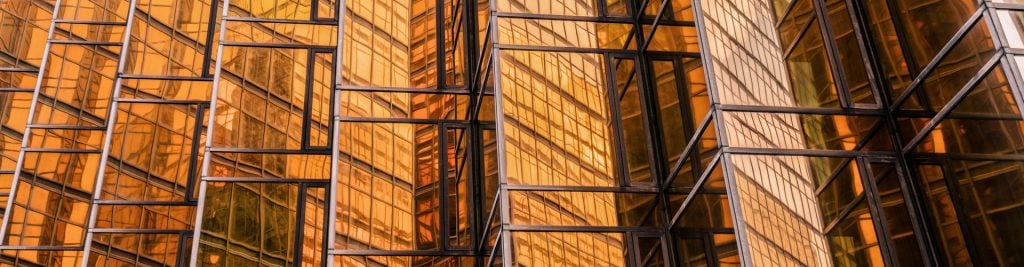 Orange colour glass reflecting on office building