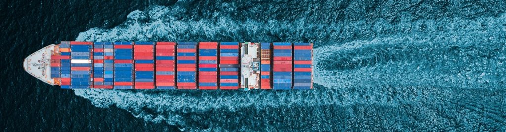 Aerial view of a shipping container sailing at sea